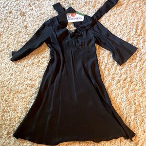 Black silk dress with tie around waist with sleeves.